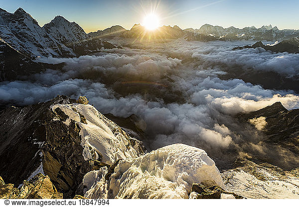 Alpine sunset over the mountains from Ama Dablam in the Himalaya
