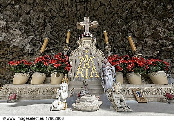 Altar with Christ cross  Mary figure  Jesus figure and angel figures in Mary grotto  replica of the grotto of Lourdes  place of pilgrimage  Bad Salzschlirf  Vogelsberg and Röhn  Fulda  Hesse  Germany  Europe