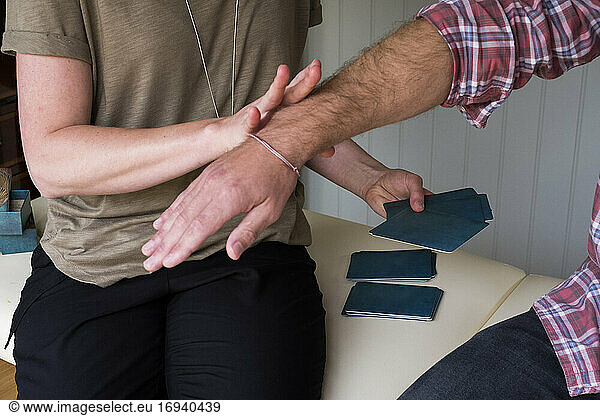Alternative therapist and man during a consultation  using EFT tapping techniques therapy