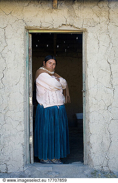 Amaryan Woman Standing In Doorway; Cordillera Real  Bolivia