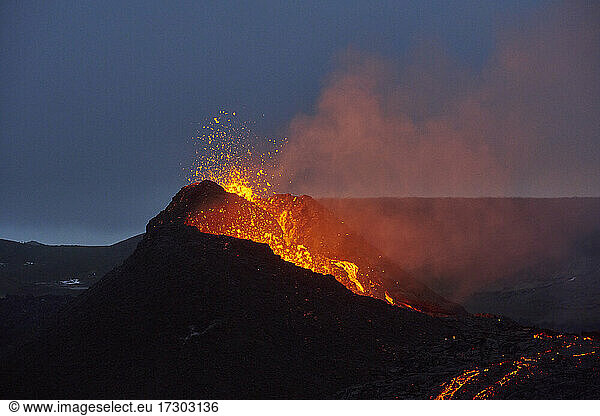 Amazing scenery of volcano eruption at night