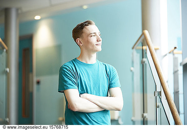 Ambitious young male college student looking away