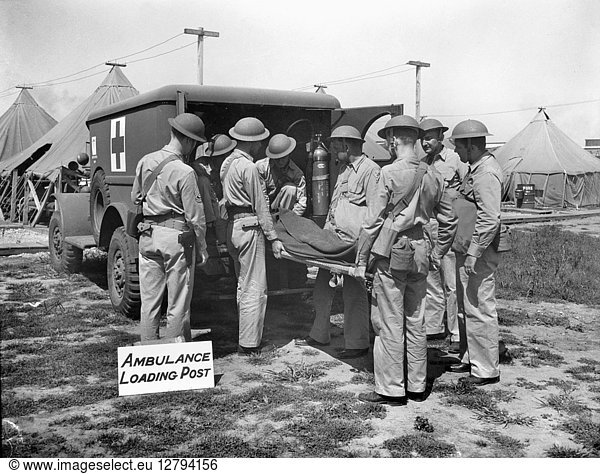 AMBULANCE TRAINING  1942. Members of a medical services unit of the U.S. Army Air Force at Dayton  Ohio  learning how to remove a casualty onto an ambulance  October 1942  during World War II.