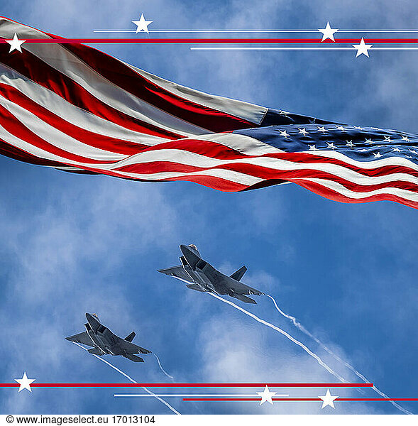 American flag blowing in wind and Lockheed Martin F-22 Raptors flying against sky