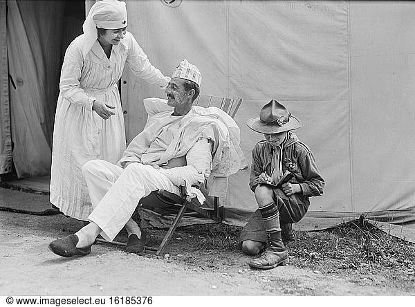 American Red Cross Nurse's Aide with injured American Soldier and Boy Scout  American Military Hospital No. 5  Auteuil  France  Lewis Wickes Hine  American National Red Cross Photograph Collection  August 1918