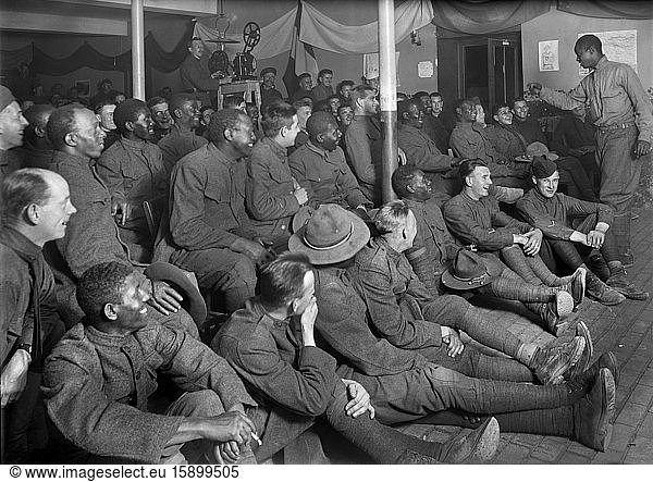 American Soldier entertaining Group of American Soldiers  American Red Cross  Recreation Hut  Orleans  France  September 1918
