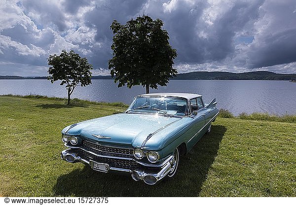 American vintage car  Cadillac Sedan de Ville  built 1959  behind the lake Glafsfjorden  Arvika  Värmland  Sweden  Europe