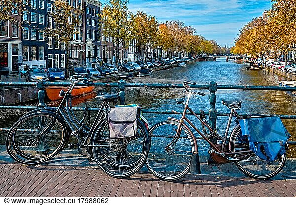 Amterdam cityscape with canal  bridge with bicycles and medieval houses. Amsterdam  Netherlands