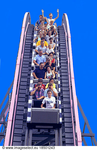 Amusement Park Rollercoaster Ride with Tourists