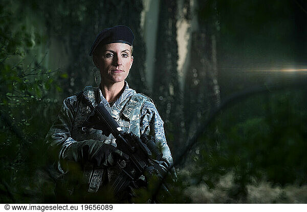 An Air Force Security Forces member patrols the area around a communications bunker during combat operations training.