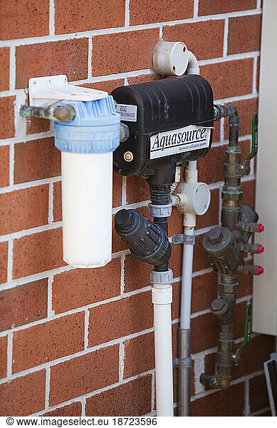 An aquasource pump on a house in Sydney. The system pumps rain water collected off the house roof and stored in an underground tank for use in flushing toilets.