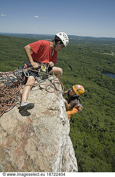 An Asian girl and a woman climbing at the Shawagunks in New Paltz  New York.