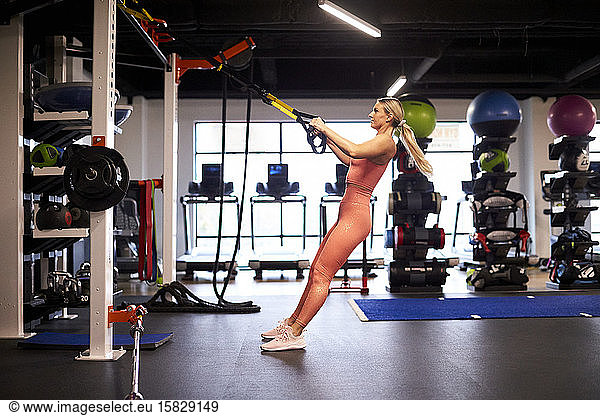 An athletic woman putting in time at the gym.