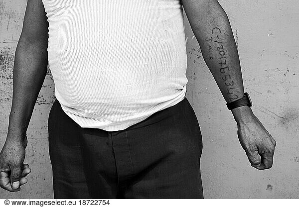 An Ecuadorean man's tattoo of his identification number confirming his citizenship in Puerto Nuevo  Ecuador.