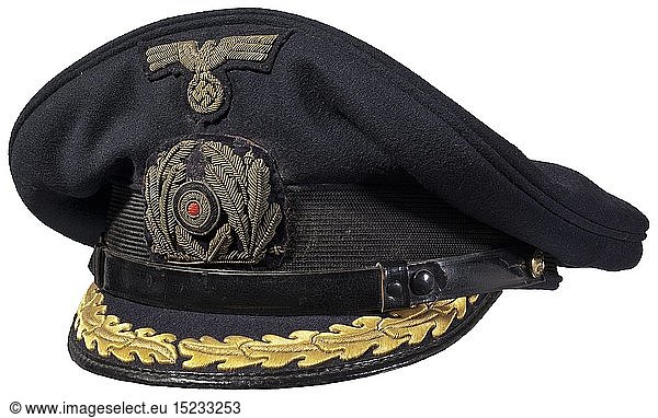 An Erel visor cap for staff officers Dark blue woollen cloth with black cap band  hand-embroidered insignia in gold  the cap visor with gold embroidery for staff officers  black patent leather chin strap. The inside with a blue silk liner and grey leather sweatband (foxed)  maker's designation (faded) 'Erel Berlin Sonderklasse' beneath the celluloid cap trapezoid. This visor cap was found by the consignor in La Rochelle during the late 1940s. historic  historical  navy  naval forces  military  militaria  branch of service  branches of service  armed forces  armed service  object  objects  stills  clipping  clippings  cut out  cut-out  cut-outs  20th century