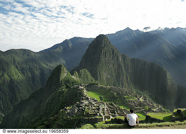 An Inca Trail Trekker admiring Machu Picchu  Peru.