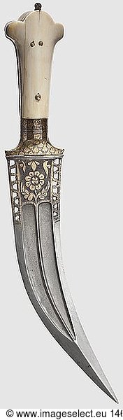 An Indian gold-inlaid 'Tiger Tooth' dagger  circa 1800 Double-edged wootz-Damascus blade with a midrib  reinforced point and edges. The base of the blade displays openwork geometric designs and cut floral designs inlaid in gold on both sides. Gold inlaid  iron mountings with riveted ivory grip scales. Length 33 cm  historic  historical  19th century  hand weapon  hand weapons  handheld  thrusting  thrustings  blade  blades  weapon  arms  weapons  arms  object  objects  stills  clipping  clippings  cut out  cut-out  cut-outs
