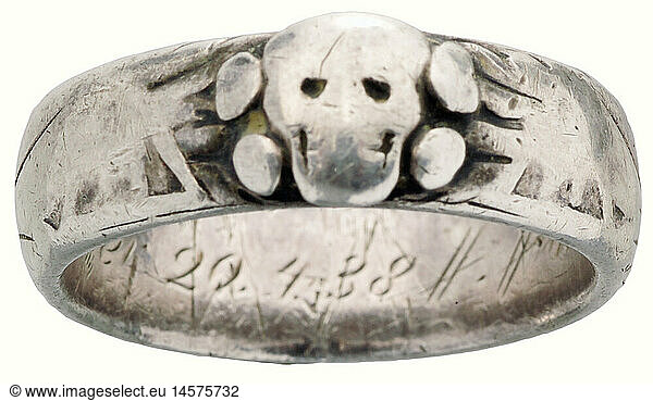 An SS death's-head ring.  Silver. Made to measure by the Gahr Jewellers in Munich  soldered together beneath the separately applied death's head. Has a dedication engraving on the inside  'S. lb. von Weppeler 20.4.38 H. Himmler' (To his well-beloved von Weppeler 20 April 1938 H. Himmler). Weight: 7.6 g. Heavy wear marks. The exterior is almost entirely effaced. Includes a photo appraisal by Detlev Niemann. historic  historical  1930s  20th century  Waffen-SS  armed division of the SS  armed service  armed services  NS  National Socialism  Nazism  Third Reich  German Reich  Germany  military  militaria  utensil  piece of equipment  utensils  object  objects  stills  clipping  clippings  cut out  cut-out  cut-outs  fascism  fascistic  National Socialist  Nazi  Nazi period  jewellery  jewelry  noble  precious
