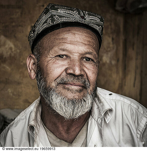 An Uighur man taking a break from work