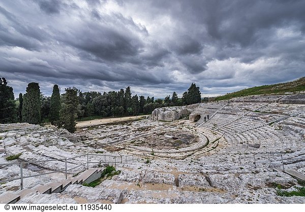 Ancient ruins of Greek Theater from 5th century BC in Neapolis Archaeological Park in Syracuse city  southeast corner of the island of Sicily  Italy.