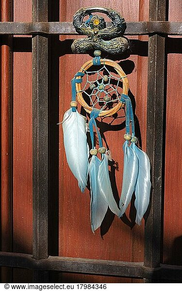 Andalusian lucky charm Indalo and dream catcher on front door