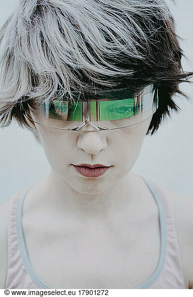 Androgynous woman wearing futuristic glasses