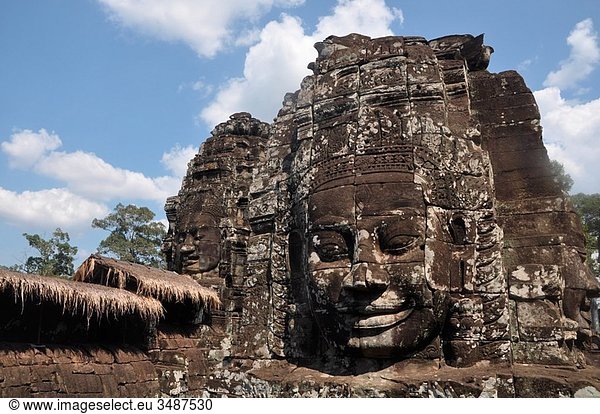 Angkor  Cambodia  Indochina  Asia  wat  temple  stone  sculpture  statue  carved  Bayon  religion  head  face  archaeology  tourism  travel  color image  color  horizontal