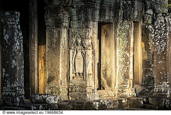 Angkor Wat temple ruins illuminated by the morning sun