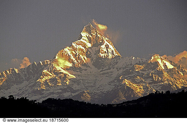 Annapurna mountain with reflection of rising sun.