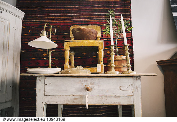 Antique objects on table in store