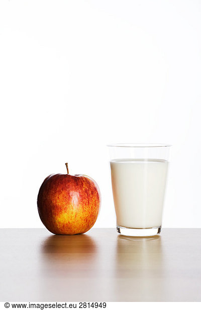 Apple and a glass of milk.