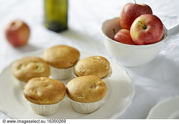 Apple muffins with cinnamon on plate