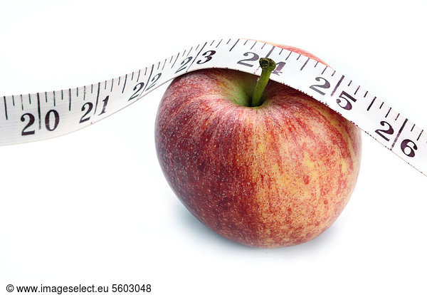 Apple with a measuring tape  symbolic image