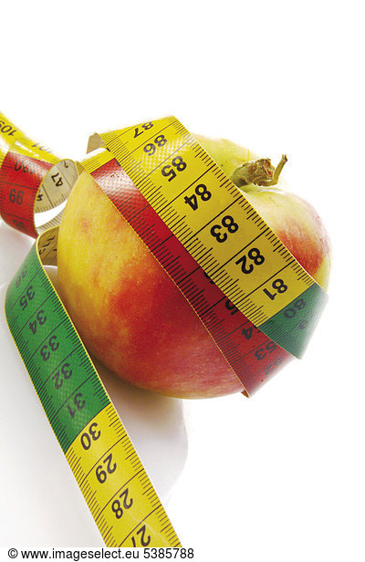 Apple with tape measure  symbolic of dieting