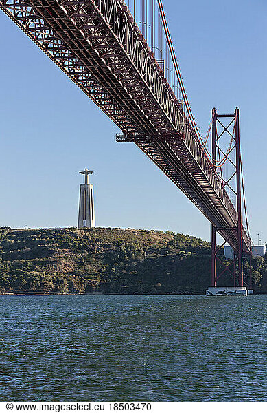 April 25th Bridge across River Tagus and Cristo Rei Statue  Lisbon  Portugal
