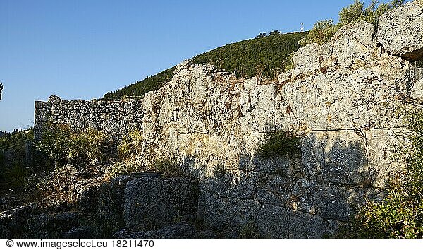 Archaeological site  School of Homer  ruins of buildings  stone wall  blue cloudless sky  Ithaca Island  blue cloudless sky  Ionian Islands  Greece  Europe