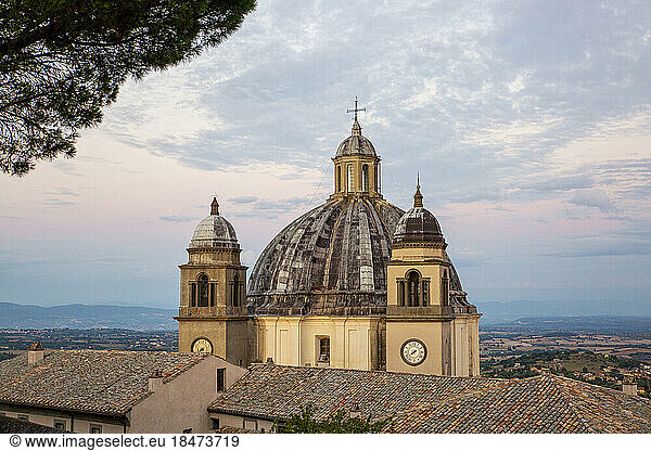 Architectural dome of Basilica Di Santa Margherita under cloudy sky
