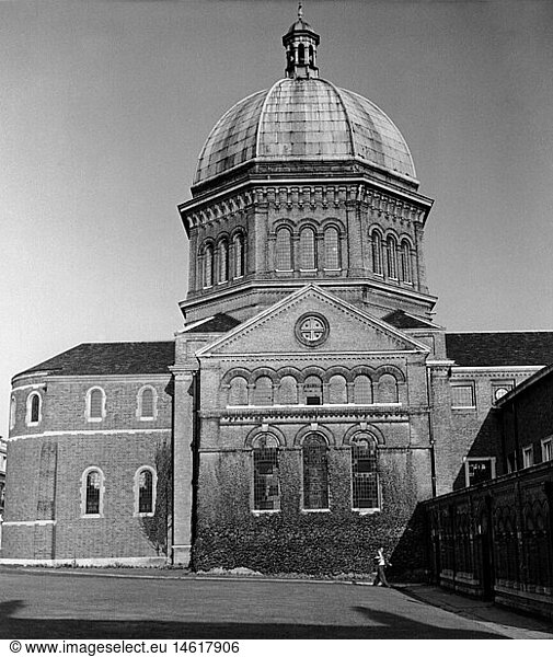 architecture  buildings  Great Britain  Haileybury and Imperia Service College  founded in 1862  chapel  exterior view  circa 1960  Europe  United Kingdom  England  historic  historical  20th century  60s  1960s  50s  1950s  geography  entrance  people