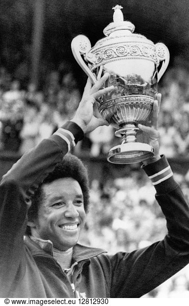 ARTHUR ASHE (1943-1993). American tennis player. Photographed after winning the men's singles final at Wimbledon  5 July 1975.