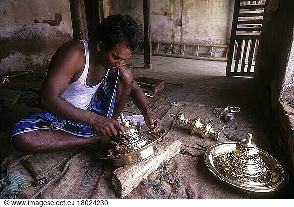 Artisan working on brass lamp  Nachiyar Koil near Thanjavur  Tamil Nadu  India  Asia