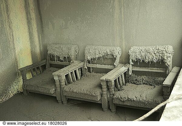 Ash-covered chairs in a house damaged by the recent volcanic eruption  Kepuharjo  Mount Merapi  Central Java  Indonesia  November 2010  Asia