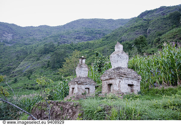 Asia  Nepal  View of tombs on grass  Nepal  Asia