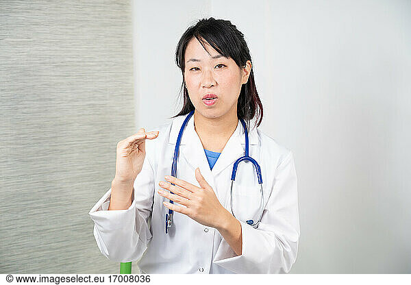 Asian female doctor during a consultation.