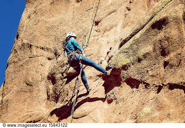 Asian Female Rock Climber at Garden of the Gods Colorado