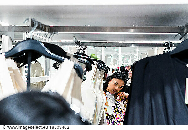 Asian girl shopping in a clothing store