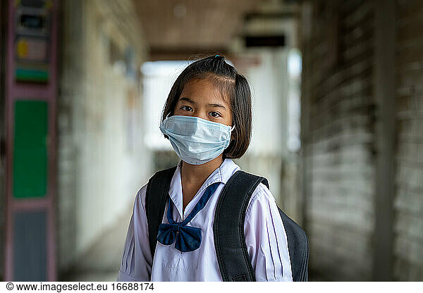 Asian students wearing protective mask to Protect Against Covid-