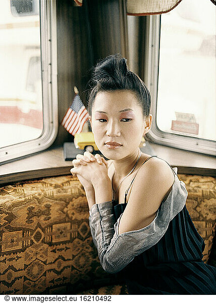 Asian woman in van  portrait