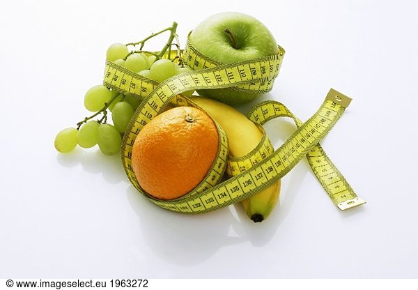 Assorted fruit with a tape measure