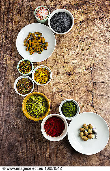 Assorted spices on wood