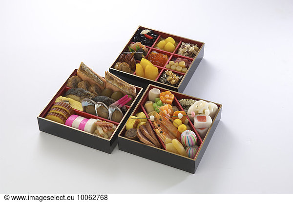 Assortment of foods in bento boxes  studio shot